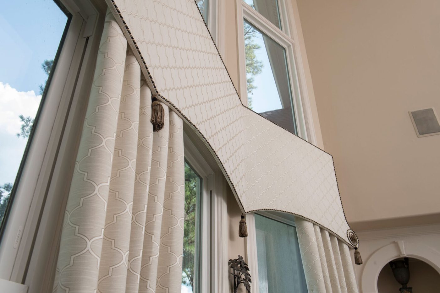 Drapery on an arched two-story window