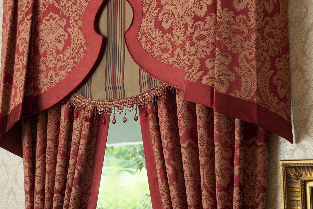 Red damask top treatment with drapery