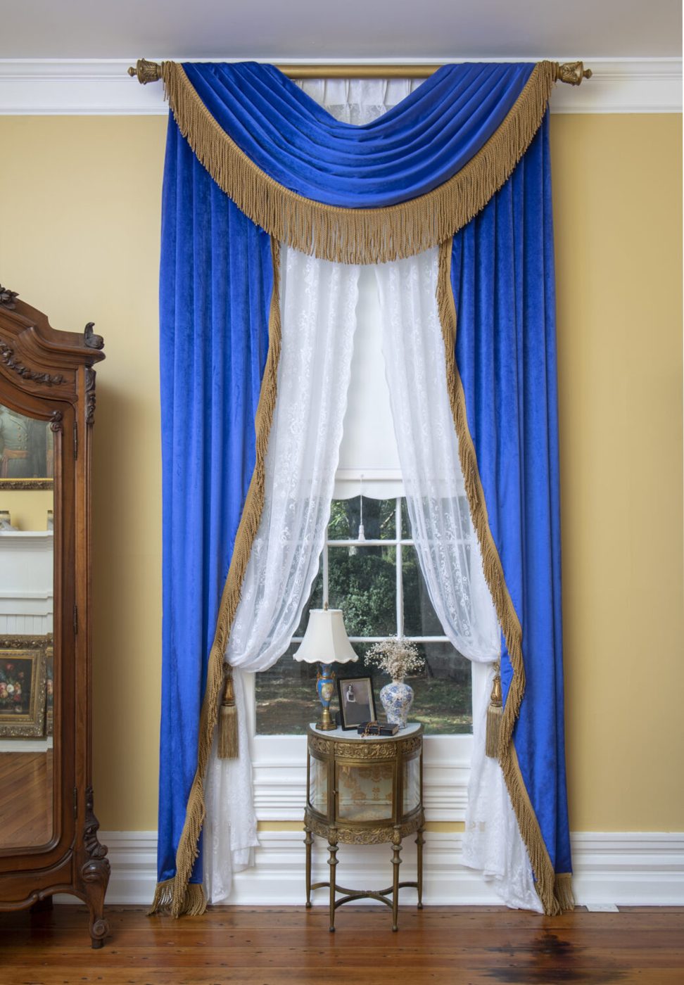 Blue and gold swag window treatment